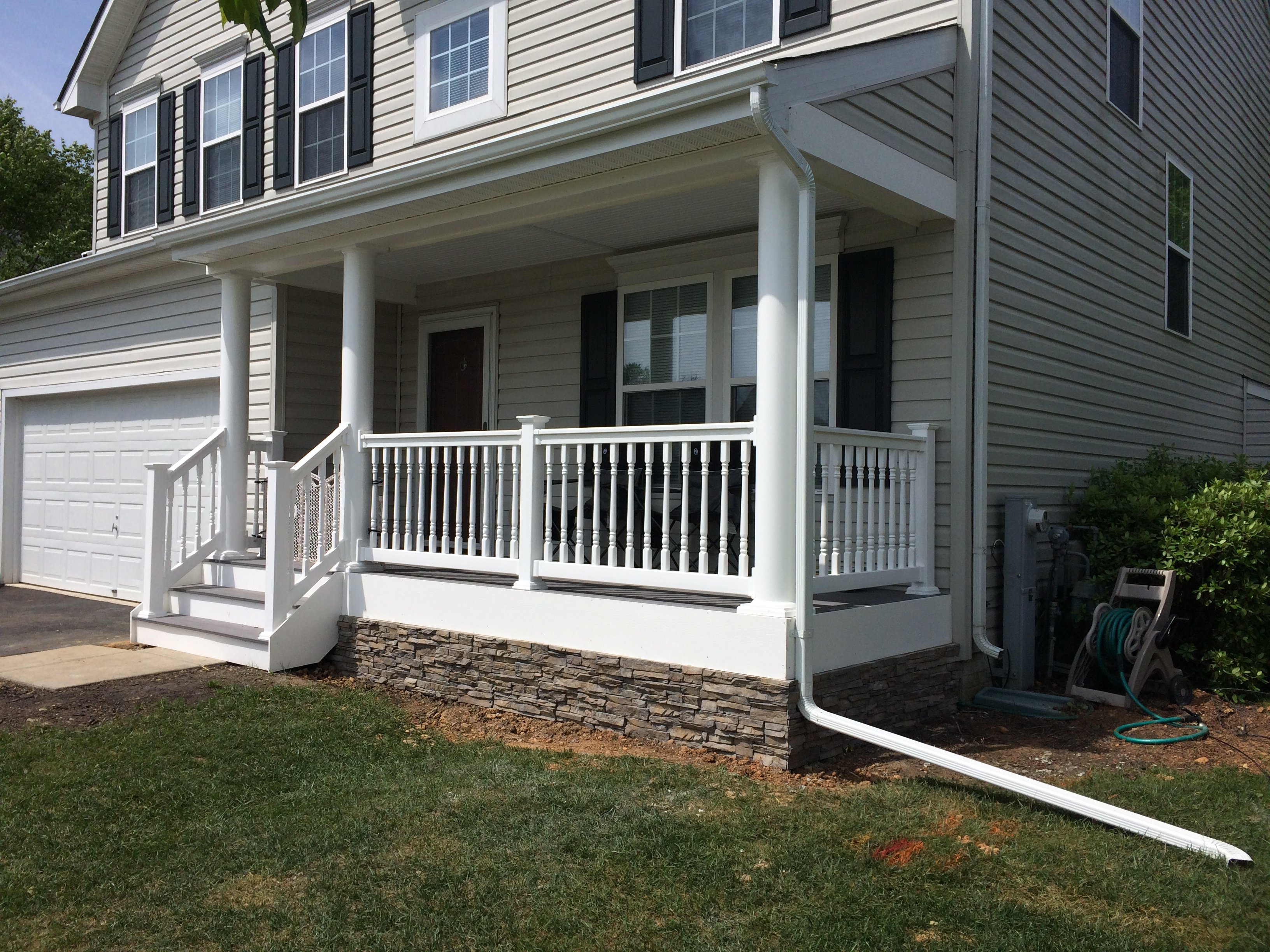 Slate Gray Porch with Round Columns, Lexington Railing, and Stone Siding