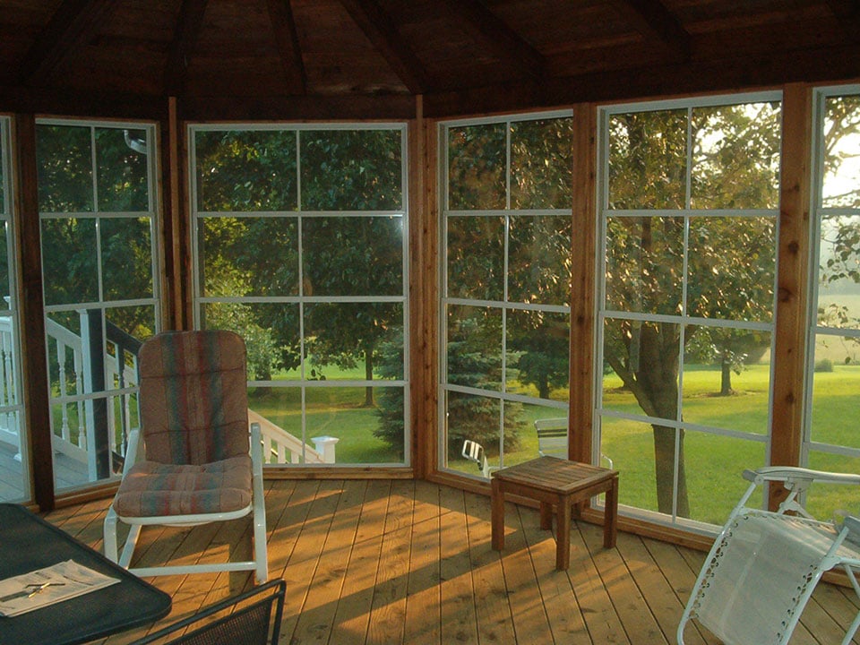 Eze-Breeze sunroom with windows and seating