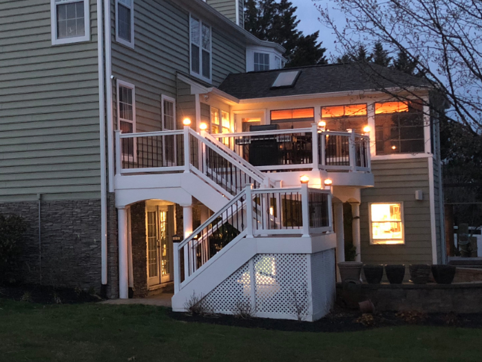 Backyard deck with lights at nighttime