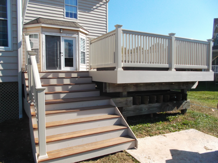 Brown deck with tan vinyl railing