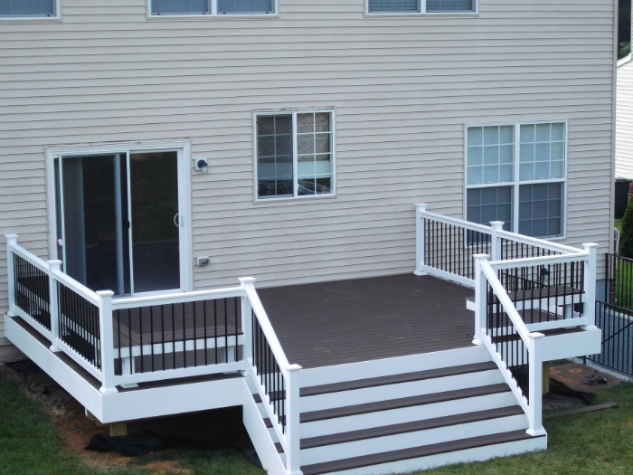 Brown deck with wide steps and black pickets