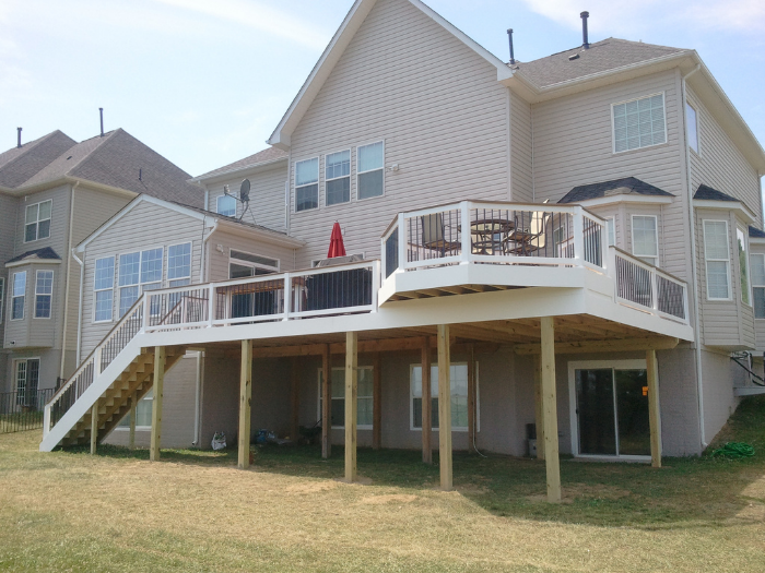 Backyard deck with brown drink rail