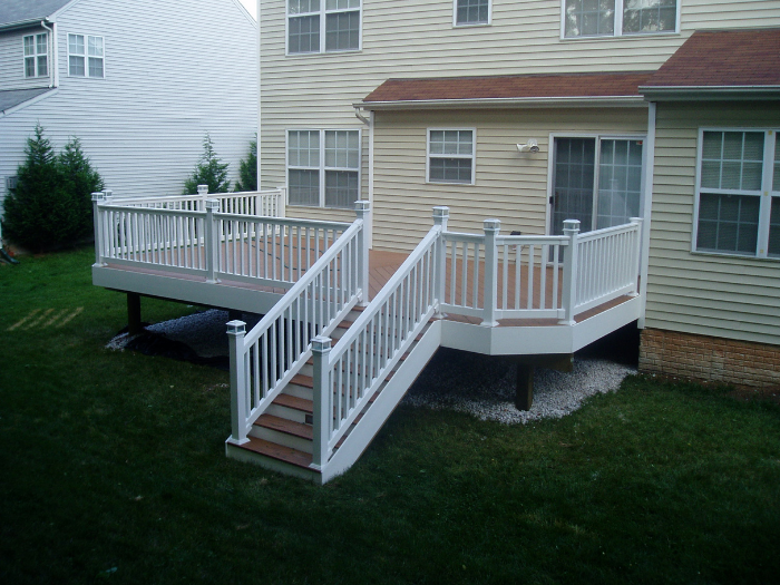 Backyard deck with light caps and brown decking