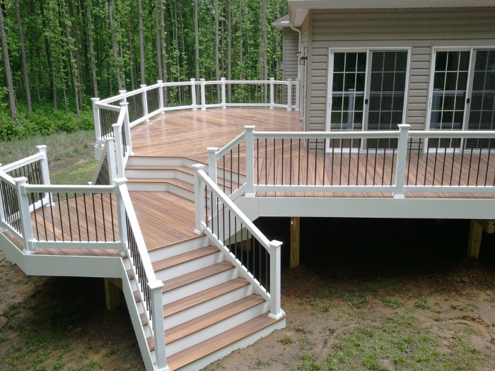 Herringbone corner deck with curved railing and two staircases