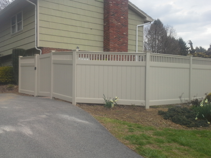 Tan Imperial privacy fence with picket top