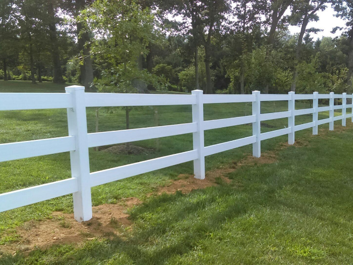 Picket vinyl fence installed by Creative Vinyl Products