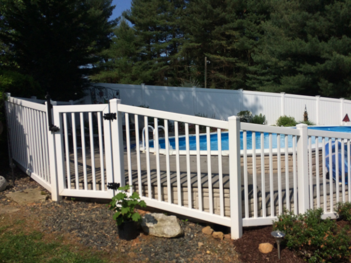 White Hampton fence around a backyard pool
