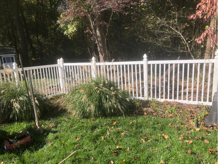 White picket fence with gothic caps