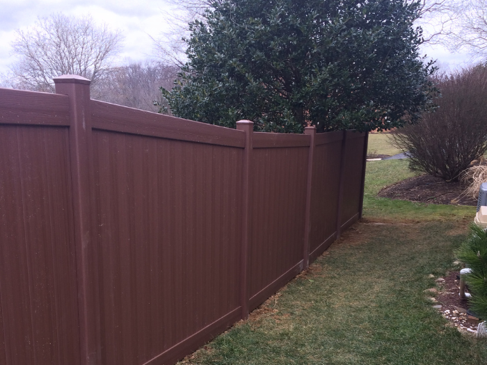 Brown vinyl privacy fence