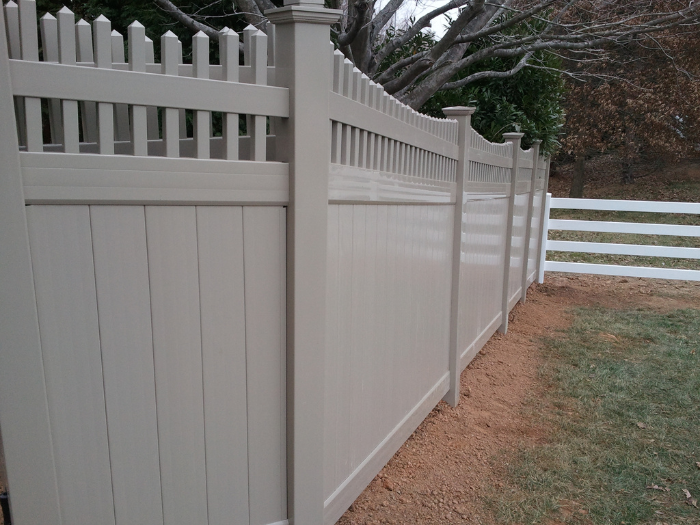 Tan vinyl privacy fence installation