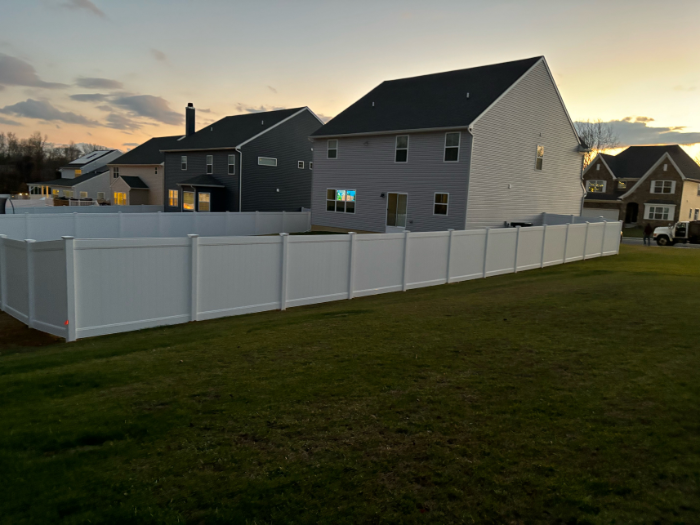 White vinyl privacy fence installation